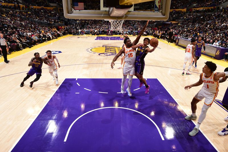 LOS ANGELES, CA - JANUARY 3: Max Christie #12 of the Los Angeles Lakers drives to the basket during the game against the Atlanta Hawks on January 3, 2025 at Crypto.Com Arena in Los Angeles, California. NOTE TO USER: User expressly acknowledges and agrees that, by downloading and/or using this Photograph, user is consenting to the terms and conditions of the Getty Images License Agreement. Mandatory Copyright Notice: Copyright 2025 NBAE (Photo by Adam Pantozzi/NBAE via Getty Images)