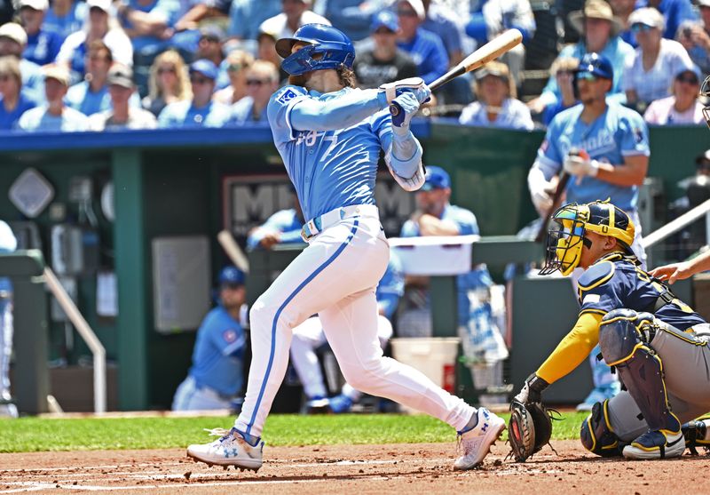 May 8, 2024; Kansas City, Missouri, USA;  Kansas City Royals shortstop Bobby Witt Jr. (7) doubles in the first inning against the Milwaukee Brewers at Kauffman Stadium. Mandatory Credit: Peter Aiken-USA TODAY Sports