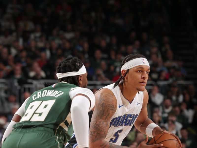 MILWAUKEE, WI - APRIL 10: Paolo Banchero #5 of the Orlando Magic looks on during the game against the Milwaukee Bucks on April 10, 2024 at the Fiserv Forum Center in Milwaukee, Wisconsin. NOTE TO USER: User expressly acknowledges and agrees that, by downloading and or using this Photograph, user is consenting to the terms and conditions of the Getty Images License Agreement. Mandatory Copyright Notice: Copyright 2024 NBAE (Photo by Gary Dineen/NBAE via Getty Images).