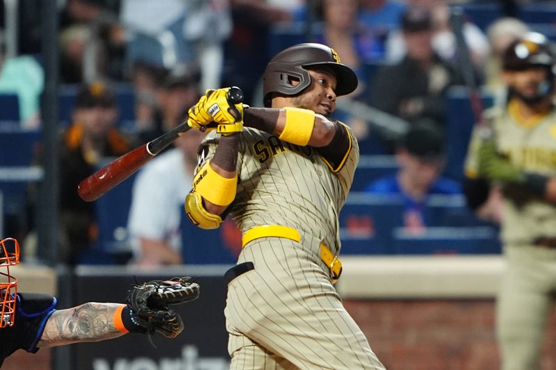 Jun 14, 2024; New York City, New York, USA;  San Diego Padres first baseman Luis Arraez (4) hits a single against the New York Mets during the first inning at Citi Field. Mandatory Credit: Gregory Fisher-USA TODAY Sports