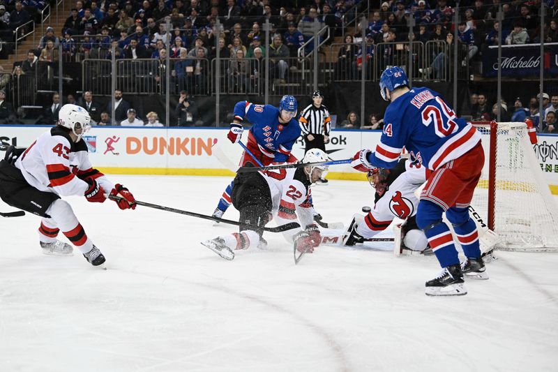 Dec 2, 2024; New York, New York, USA;  New Jersey Devils goaltender Jacob Markstrom (25) makes a save against the New York Rangers during the second period at Madison Square Garden. Mandatory Credit: Dennis Schneidler-Imagn Images