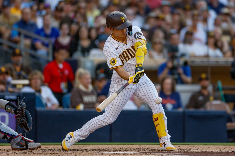 Jul 29, 2023; San Diego, California, USA; San Diego Padres second baseman Ha-Seong Kim (7) hits a RBI single during the second inning against the Texas Rangers at Petco Park. Mandatory Credit: David Frerker-USA TODAY Sports
