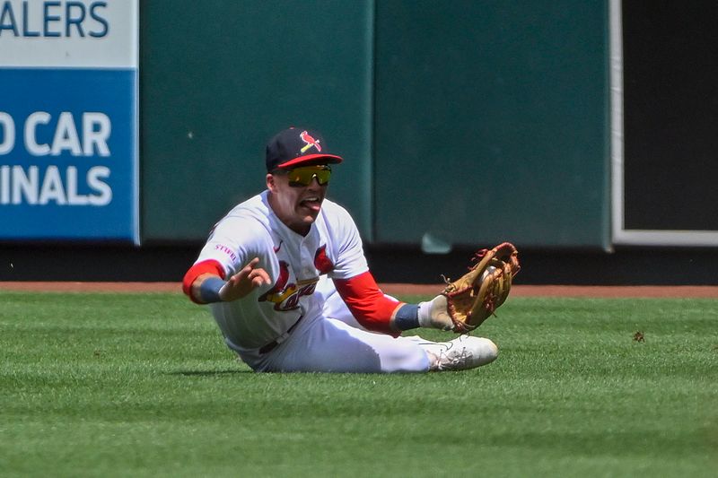 May 7, 2023; St. Louis, Missouri, USA;  St. Louis Cardinals right fielder Lars Nootbaar (21) dives and catches a line drive against the Detroit Tigers during the sixth inning at Busch Stadium. Mandatory Credit: Jeff Curry-USA TODAY Sports