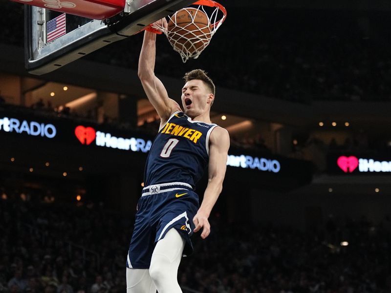 AUSTIN, TX - MARCH 15: Christian Braun #0 of the Denver Nuggets dunks the ball during the game against the San Antonio Spurs on March 15, 2024 at the Moody Center in Austin, Texas. NOTE TO USER: User expressly acknowledges and agrees that, by downloading and/or using this Photograph, user is consenting to the terms and conditions of the Getty Images License Agreement. Mandatory Copyright Notice: Copyright 2024 NBAE (Photo by Garrett Ellwood/NBAE via Getty Images)