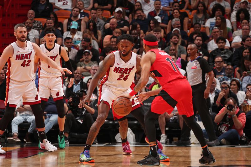 MIAMI, FL - APRIL 12:  Haywood Highsmith #24 of the Miami Heat plays defense during the game against the Toronto Raptors on April 12, 2024 at Kaseya Center in Miami, Florida. NOTE TO USER: User expressly acknowledges and agrees that, by downloading and or using this Photograph, user is consenting to the terms and conditions of the Getty Images License Agreement. Mandatory Copyright Notice: Copyright 2024 NBAE (Photo by Issac Baldizon/NBAE via Getty Images)