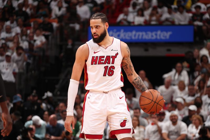 MIAMI, FL - APRIL 27: Caleb Martin #16 of the Miami Heat handles the ball during the game against the Boston Celtics during Round 1 Game 3 of the 2024 NBA Playoffs on April 27, 2024 at Kaseya Center in Miami, Florida. NOTE TO USER: User expressly acknowledges and agrees that, by downloading and or using this Photograph, user is consenting to the terms and conditions of the Getty Images License Agreement. Mandatory Copyright Notice: Copyright 2024 NBAE (Photo by Issac Baldizon/NBAE via Getty Images)