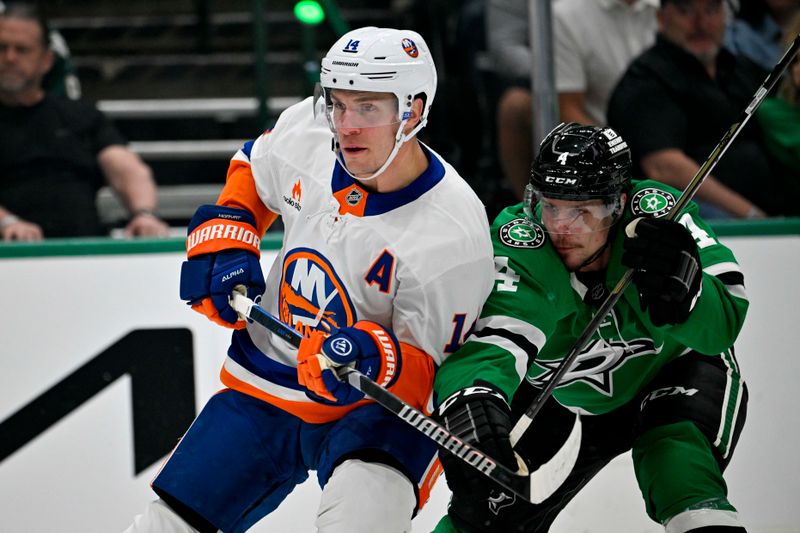 Oct 12, 2024; Dallas, Texas, USA; New York Islanders center Bo Horvat (14) and Dallas Stars defenseman Miro Heiskanen (4) chase the puck during the first period at the American Airlines Center. Mandatory Credit: Jerome Miron-Imagn Images