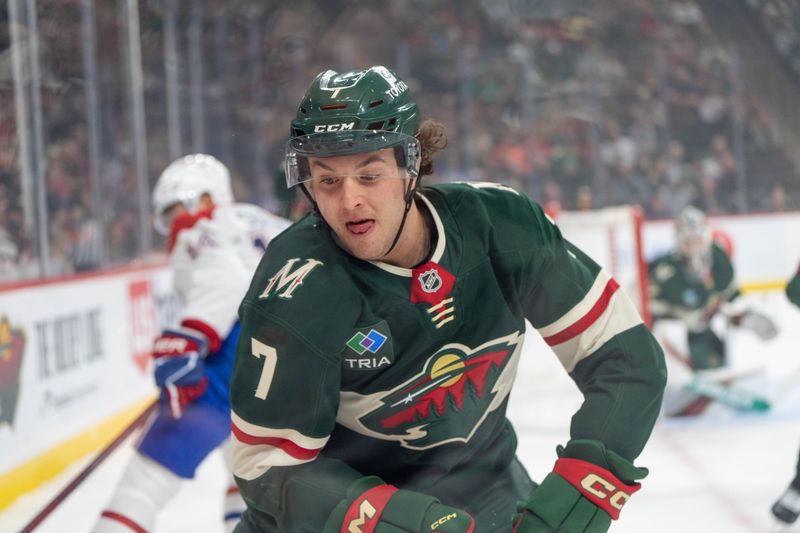 Nov 14, 2024; Saint Paul, Minnesota, USA; Minnesota Wild defenseman Brock Faber (7) plays the puck against the Montreal Canadiens in the first period at Xcel Energy Center. Mandatory Credit: Matt Blewett-Imagn Images