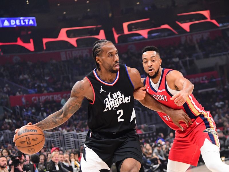 LOS ANGELES, CA - FEBRUARY 7: Kawhi Leonard #2 of the LA Clippers handles the ball against CJ McCollum #3 of the New Orleans Pelicans during the game on February 7, 2024 at Crypto.Com Arena in Los Angeles, California. NOTE TO USER: User expressly acknowledges and agrees that, by downloading and/or using this Photograph, user is consenting to the terms and conditions of the Getty Images License Agreement. Mandatory Copyright Notice: Copyright 2024 NBAE (Photo by Adam Pantozzi/NBAE via Getty Images)