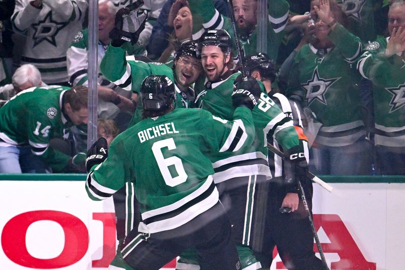 May 11, 2025; Dallas, Texas, USA; Dallas Stars left wing Jason Robertson (21) and defenseman Alexander Petrovic (28) and defenseman Lian Bichsel (6) celebrates the game winning goal scored by Petrovic against the Winnipeg Jets during the third period in game three of the second round of the 2025 Stanley Cup Playoffs at American Airlines Center. Mandatory Credit: Jerome Miron-Imagn Images
