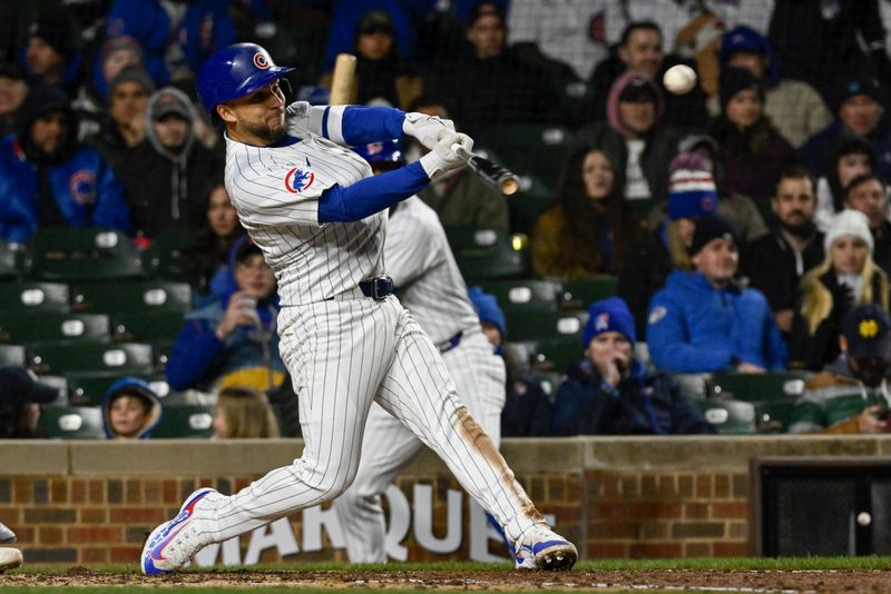 Apr 2, 2024; Chicago, Illinois, USA; Chicago Cubs third baseman Nick Madrigal (1) hits a two rbi double against the Colorado Rockies during the third inning at Wrigley Field. Mandatory Credit: Matt Marton-USA TODAY Sports