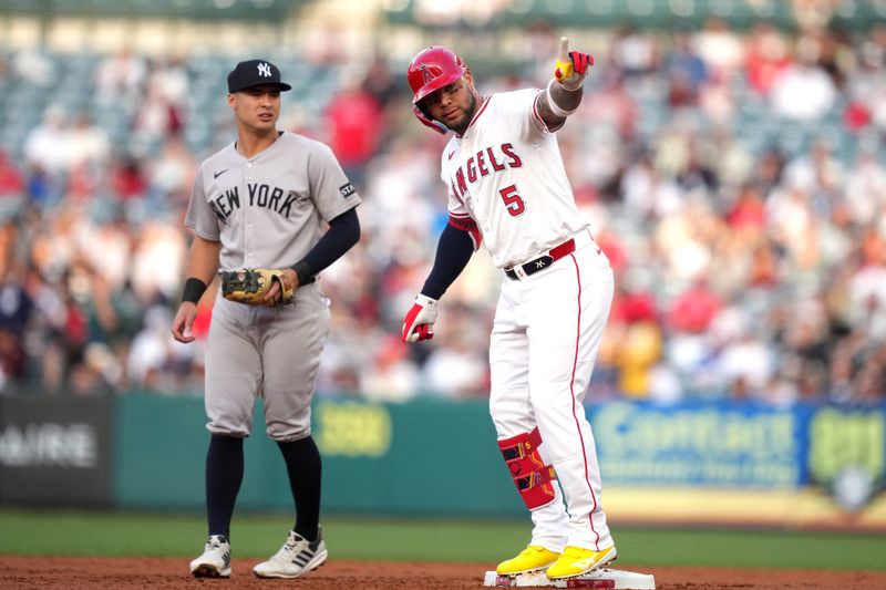 May 28, 2025; Anaheim, California, USA; Los Angeles Angels third baseman Yoan Moncada (5) gestures after hitting a double in the first inning against the New York Yankees at Angel Stadium. Mandatory Credit: Kirby Lee-Imagn Images
