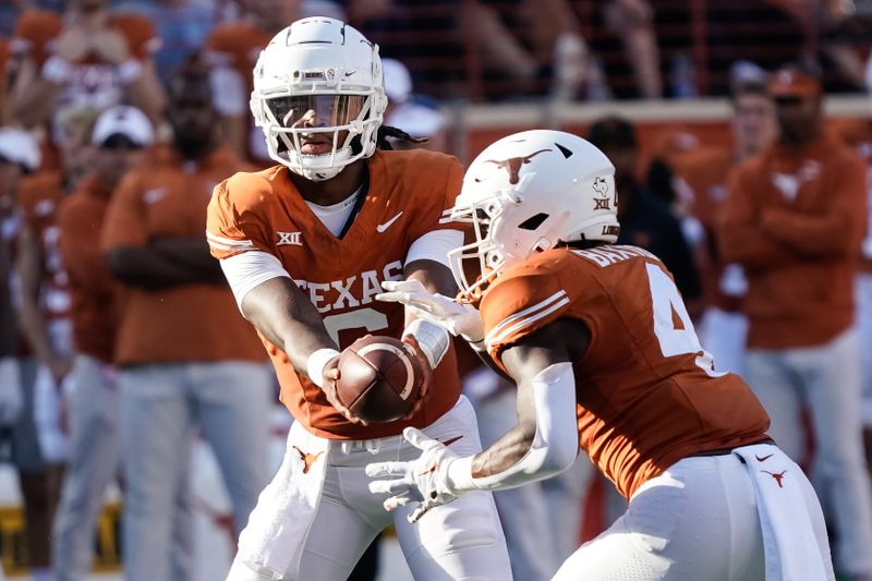 Oct 28, 2023; Austin, Texas, USA; Texas Longhorns quarterback Maalik Murphy (6) hands off to running back CJ Baxter (4) during the second half against the Brigham Young Cougars at Darrell K Royal-Texas Memorial Stadium. Mandatory Credit: Scott Wachter-USA TODAY Sports