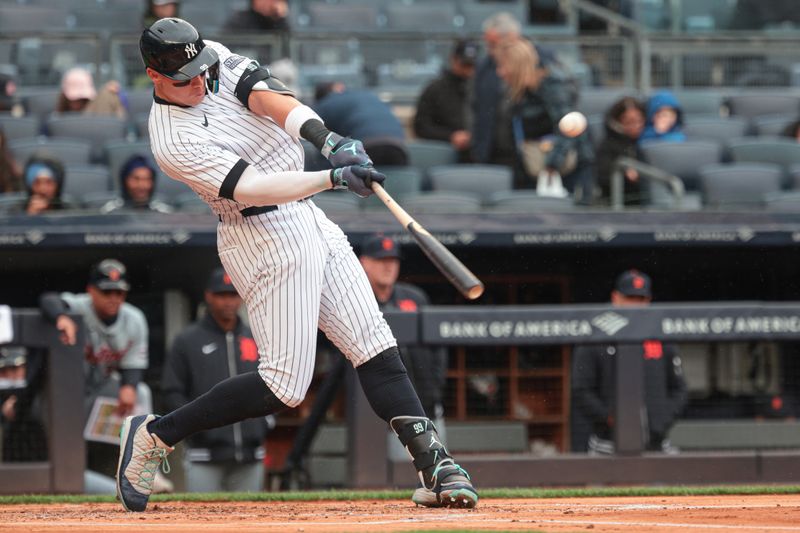 May 5, 2024; Bronx, New York, USA; New York Yankees center fielder Aaron Judge (99) hits a solo home run during the first inning against the Detroit Tigers at Yankee Stadium. Mandatory Credit: Vincent Carchietta-USA TODAY Sports