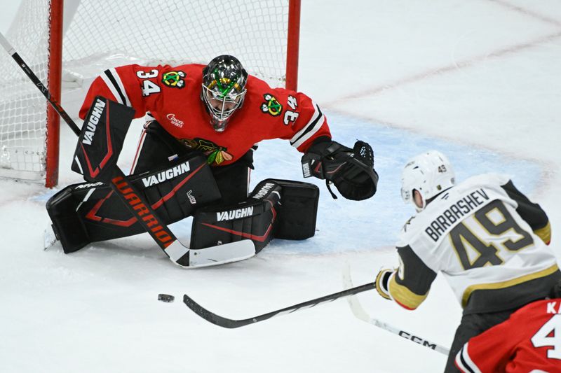 Jan 18, 2025; Chicago, Illinois, USA;  Chicago Blackhawks goaltender Petr Mrazek (34) defends against Vegas Golden Knights center Ivan Barbashev (49) during the second period at United Center. Mandatory Credit: Matt Marton-Imagn Images