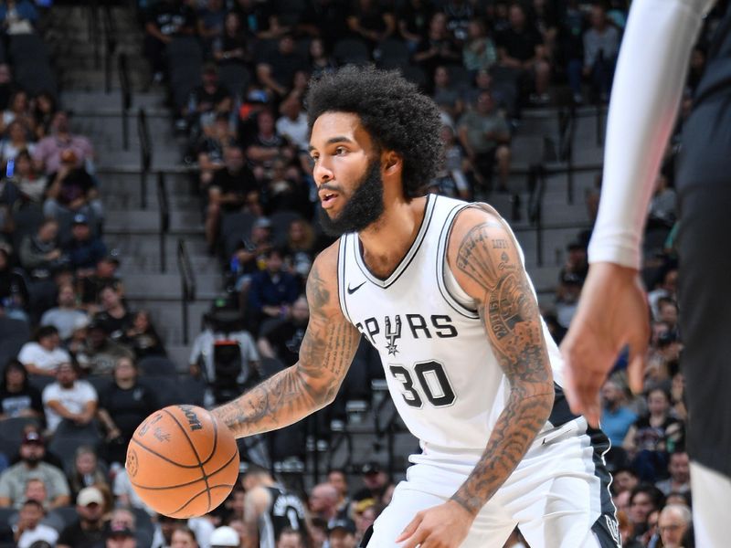 SAN ANTONIO, TX - NOVEMBER 7: Julian Champagnie #30 of the San Antonio Spurs dribbles the ball during the game against the Portland Trail Blazers on November 7, 2024 at the Frost Bank Center in San Antonio, Texas. NOTE TO USER: User expressly acknowledges and agrees that, by downloading and or using this photograph, user is consenting to the terms and conditions of the Getty Images License Agreement. Mandatory Copyright Notice: Copyright 2024 NBAE (Photos by Michael Gonzales/NBAE via Getty Images)