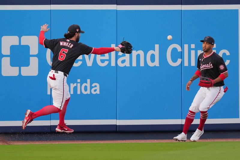 Mar 14, 2024; West Palm Beach, Florida, USA; Washington Nationals left fielder Jesse Winker (6) and center fielder Eddie Rosario (19) chase down a double by Houston Astros left fielder Chas McCormick (20) in the fifth inning at CACTI Park of the Palm Beaches. Mandatory Credit: Jim Rassol-USA TODAY Sports