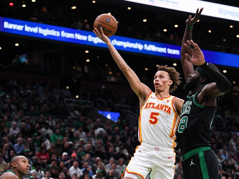 BOSTON, MASSACHUSETTS - NOVEMBER 12: Dyson Daniels #5 of the Atlanta Hawks lays up a shot against against Neemias Queta #88 of the Boston Celtics during the first half of an Emirates NBA cup game at TD Garden on November 12, 2024 in Boston, Massachusetts. NOTE TO USER: User expressly acknowledges and agrees that, by downloading and or using this photograph, User is consenting to the terms and conditions of the Getty Images License Agreement. (Photo by China Wong/Getty Images)