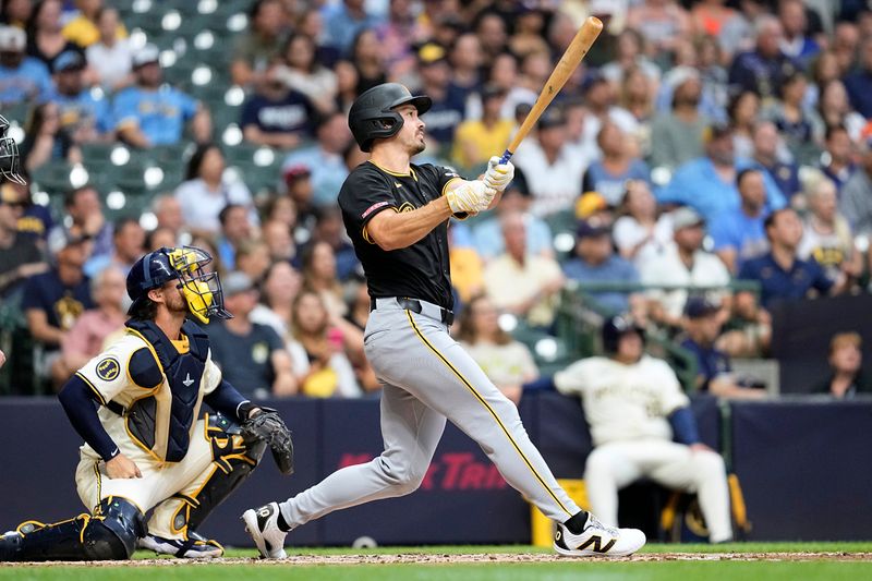 Jul 9, 2024; Milwaukee, Wisconsin, USA;  Pittsburgh Pirates designated hitter Bryan Reynolds (10) hits a home run during the second inning against the Milwaukee Brewers at American Family Field. Mandatory Credit: Jeff Hanisch-USA TODAY Sports