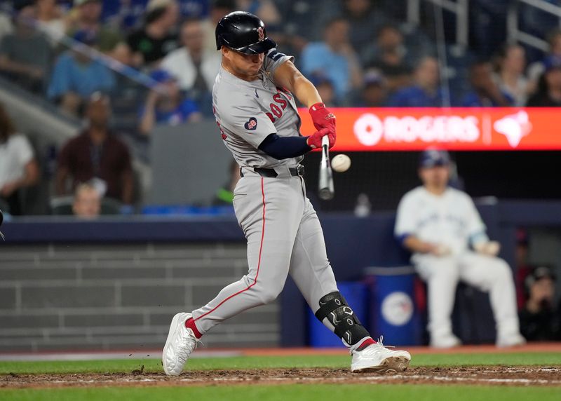 Jun 18, 2024; Toronto, Ontario, CAN; Boston Red Sox left fielder Rob Refsnyder (30) makes contact with the ball during the ninth inning  against the Toronto Blue Jays at Rogers Centre. Mandatory Credit: John E. Sokolowski-USA TODAY Sports