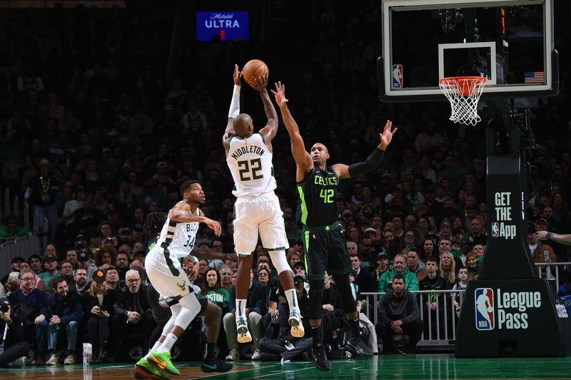 BOSTON, MA - DECEMBER 6: Khris Middleton #22 of the Milwaukee Bucks shoots a three point basket during the game  against the Boston Celtics on December 6, 2024 at TD Garden in Boston, Massachusetts. NOTE TO USER: User expressly acknowledges and agrees that, by downloading and/or using this Photograph, user is consenting to the terms and conditions of the Getty Images License Agreement. Mandatory Copyright Notice: Copyright 2024 NBAE (Photo by Brian Babineau/NBAE via Getty Images)