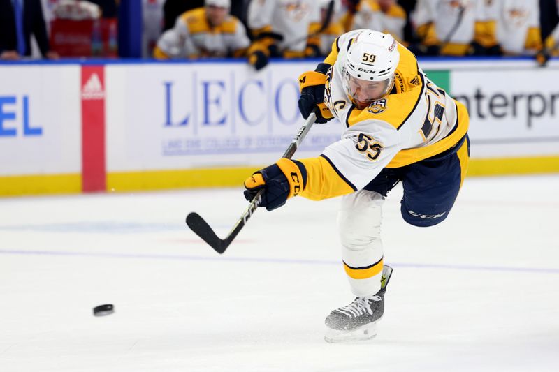 Dec 3, 2023; Buffalo, New York, USA;  Nashville Predators defenseman Roman Josi (59) takes a shot on goal during the first period against the Buffalo Sabres at KeyBank Center. Mandatory Credit: Timothy T. Ludwig-USA TODAY Sports