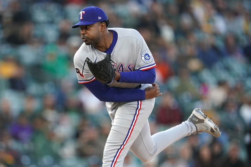 Apr 23, 2025; West Sacramento, California, USA; Texas Rangers pitcher Kumar Rocker (80) follows through on a pitch against the Athletics in the first inning at Sutter Health Park. Mandatory Credit: Cary Edmondson-Imagn Images