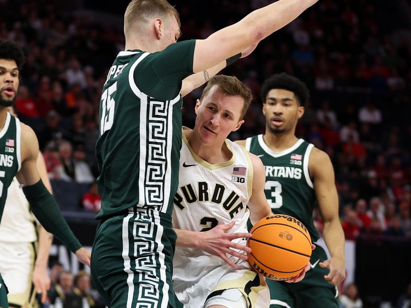 Mar 15, 2024; Minneapolis, MN, USA; Purdue Boilermakers guard Fletcher Loyer (2) works towards the basket as Michigan State Spartans center Carson Cooper (15) defends during the first half at Target Center. Mandatory Credit: Matt Krohn-USA TODAY Sports