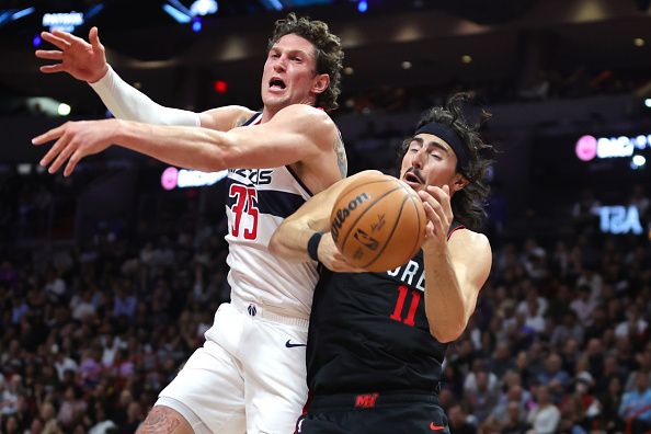 MIAMI, FLORIDA - NOVEMBER 03: Mike Muscala #35 of the Washington Wizards and Jaime Jaquez Jr. #11 of the Miami Heat compete for a rebound in the fourth quarter during the NBA In-Season Tournament at Kaseya Center on November 03, 2023 in Miami, Florida. NOTE TO USER: User expressly acknowledges and agrees that, by downloading and or using this photograph, User is consenting to the terms and conditions of the Getty Images License Agreement. (Photo by Megan Briggs/Getty Images)