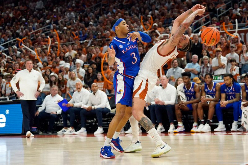 Mar 4, 2023; Austin, Texas, USA; Kansas Jayhawks guard Dajuan Harris Jr. (3) forces the ball away from Texas Longhorns forward Timmy Allen (0) during the first half at Moody Center. Mandatory Credit: Scott Wachter-USA TODAY Sports