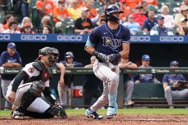 Sep 25, 2025; Baltimore, Maryland, USA; Tampa Bay Rays pinch hitter Tristan Gray (10) drives in a run during the sixth inning against the Baltimore Orioles at Oriole Park at Camden Yards. Mandatory Credit: Mitch Stringer-Imagn Images