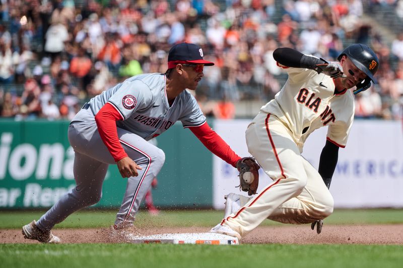 Apr 10, 2024; San Francisco, California, USA; San Francisco Giants shortstop Nick Ahmed (16) slides safely into third base against Washington Nationals third baseman Trey Lipscomb (38 during the sixth inning at Oracle Park. Mandatory Credit: Robert Edwards-USA TODAY Sports