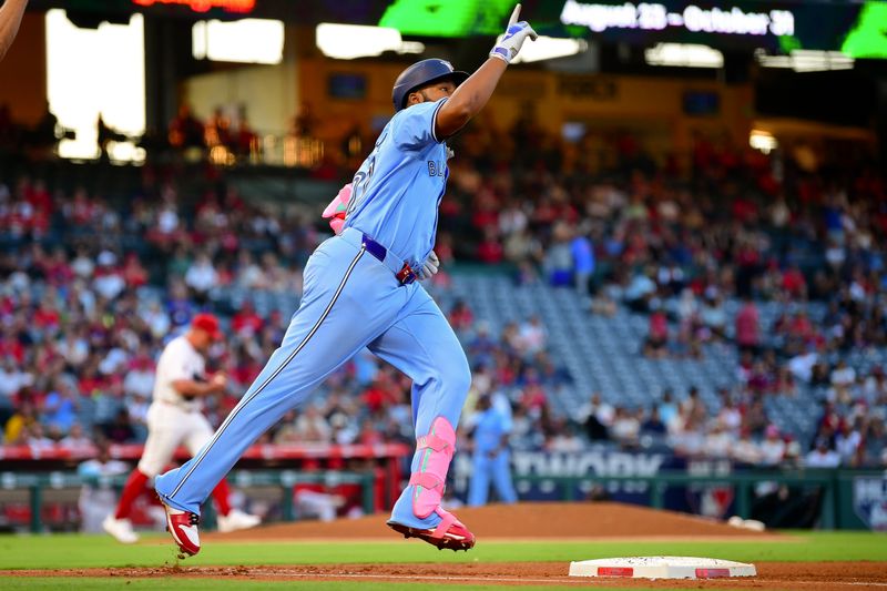 Aug 13, 2024; Anaheim, California, USA; Toronto Blue Jays first baseman Vladimir Guerrero Jr. (27) runs the bases after hitting a solo home run against the Los Angeles Angels during the third inning at Angel Stadium. Mandatory Credit: Gary A. Vasquez-USA TODAY Sports