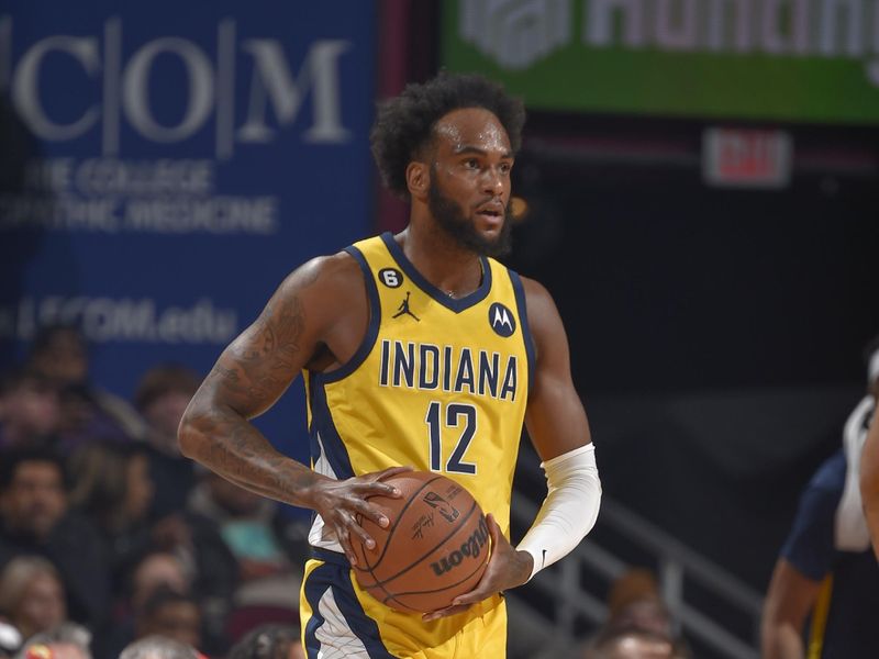 CLEVELAND, OH - APRIL 2:  Oshae Brissett #12 of the Indiana Pacers handles the ball during the game  on April 2, 2023 at Rocket Mortgage FieldHouse in Cleveland, Ohio. NOTE TO USER: User expressly acknowledges and agrees that, by downloading and/or using this Photograph, user is consenting to the terms and conditions of the Getty Images License Agreement. Mandatory Copyright Notice: Copyright 2023 NBAE (Photo by David Liam Kyle/NBAE via Getty Images)