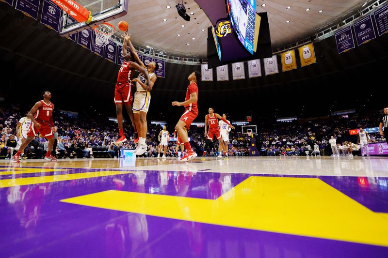 Feb 4, 2023; Baton Rouge, Louisiana, USA; LSU Tigers forward Shawn Phillips (34) shoots the ball against Alabama Crimson Tide center Charles Bediako (14) during the first half at Pete Maravich Assembly Center. Mandatory Credit: Andrew Wevers-USA TODAY Sports