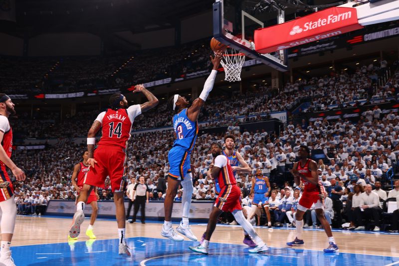 OKLAHOMA CITY, OK - APRIL 24: Shai Gilgeous-Alexander #2 of the Oklahoma City Thunder drives to the basket during the game against the New Orleans Pelicans during Round 1 Game 2 of the 2024 NBA Playoffs on April 24, 2024 at Paycom Arena in Oklahoma City, Oklahoma. NOTE TO USER: User expressly acknowledges and agrees that, by downloading and or using this photograph, User is consenting to the terms and conditions of the Getty Images License Agreement. Mandatory Copyright Notice: Copyright 2024 NBAE (Photo by Zach Beeker/NBAE via Getty Images)