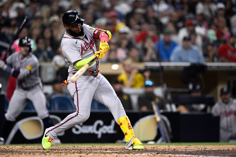 Jul 12, 2024; San Diego, California, USA; Atlanta Braves designated hitter Marcell Ozuna (20) hits a home run against the San Diego Padres during the ninth inning at Petco Park. Mandatory Credit: Orlando Ramirez-USA TODAY Sports 