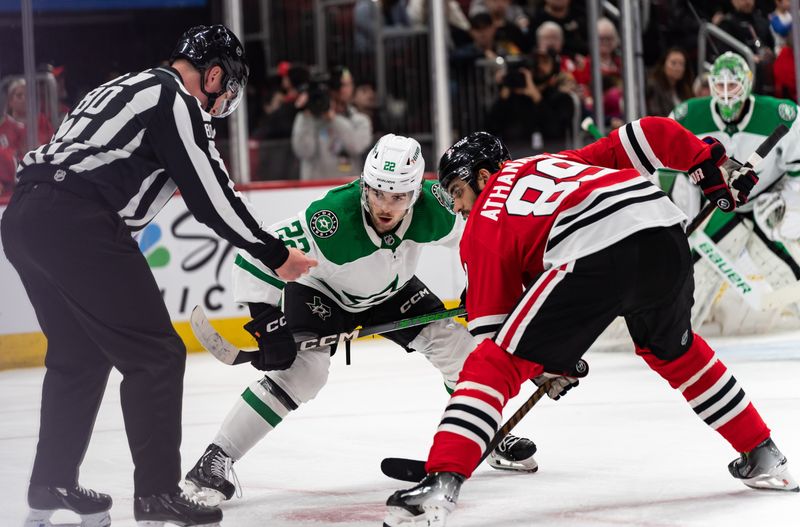 Apr 6, 2024; Chicago, Illinois, USA; Dallas Stars center Mavrik Bourque (22) and Chicago Blackhawks center Andreas Athanasiou (89) face off during the first period at United Center. Mandatory Credit: Seeger Gray-USA TODAY Sports