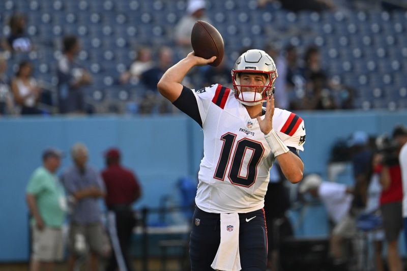 New England Patriots quarterback Mac Jones (10) warms up before an NFL preseason football game against the Tennessee Titans Friday, Aug. 25, 2023, in Nashville, Tenn. (AP Photo/John Amis)