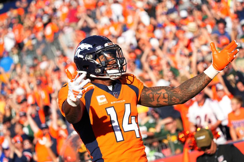 Denver Broncos wide receiver Courtland Sutton (14) celebrates a touchdown against the Green Bay Packers of an NFL football game Sunday October 22, 2023, in Denver. (AP Photo/Bart Young)