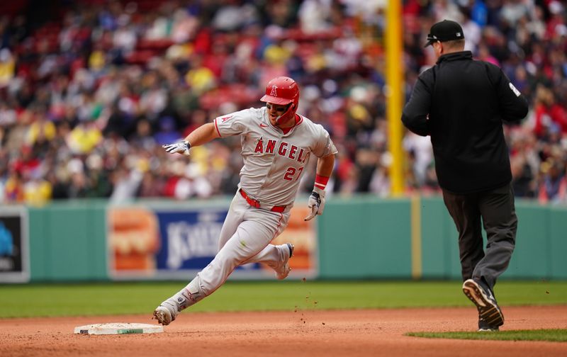 Apr 14, 2024; Boston, Massachusetts, USA; Los Angeles Angels center fielder Mike Trout (27) hits a triple against the Boston Red Sox in the eighth inning at Fenway Park. Mandatory Credit: David Butler II-USA TODAY Sports