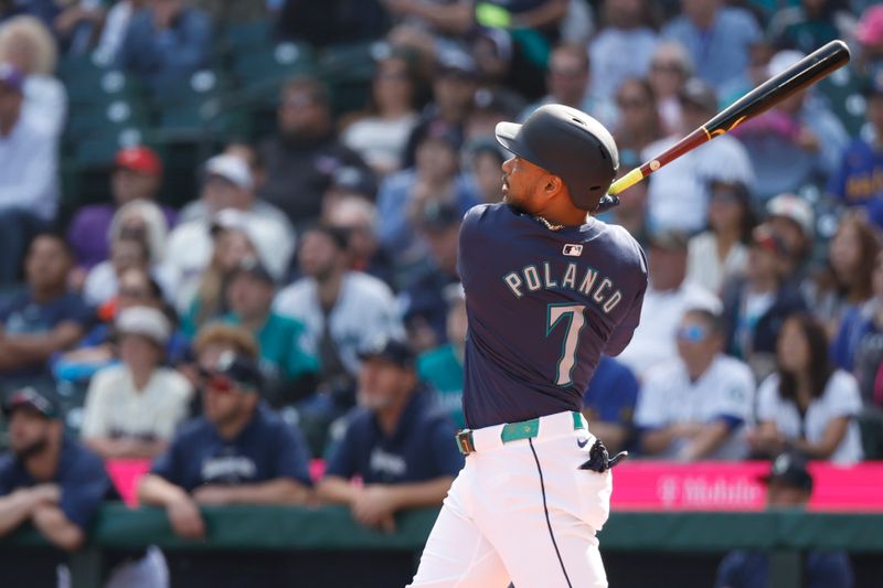 Sep 19, 2024; Seattle, Washington, USA; Seattle Mariners designated hitter Jorge Polanco (7) hits an RBI-sacrifice fly against the New York Yankees during the first inning at T-Mobile Park. Mandatory Credit: Joe Nicholson-Imagn Images