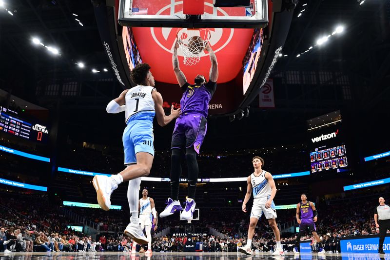 ATLANTA, GA - DECEMBER 6: Anthony Davis #3 of the Los Angeles Lakers dunks the ball during the game against the Atlanta Hawks on December 6, 2024 at State Farm Arena in Atlanta, Georgia.  NOTE TO USER: User expressly acknowledges and agrees that, by downloading and/or using this Photograph, user is consenting to the terms and conditions of the Getty Images License Agreement. Mandatory Copyright Notice: Copyright 2024 NBAE (Photo by Adam Hagy/NBAE via Getty Images)