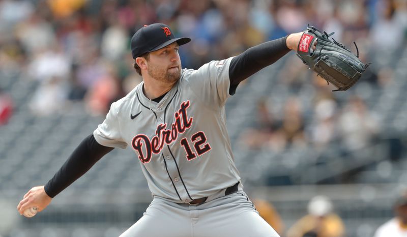 Apr 9, 2024; Pittsburgh, Pennsylvania, USA;  Detroit Tigers starting pitcher Casey Mize (12) throws against the Pittsburgh Pirates during the first inning at PNC Park. Mandatory Credit: Charles LeClaire-USA TODAY Sports