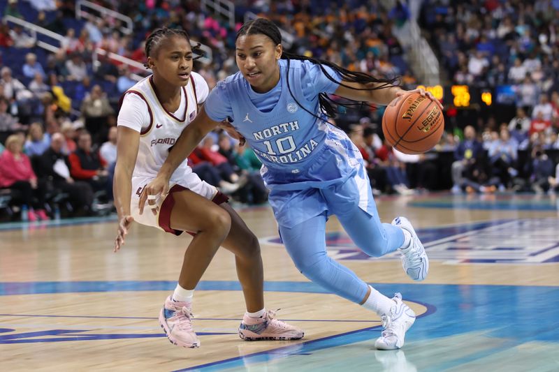 Mar 7, 2025; Greensboro, NC, USA;  North Carolina Tar Heels guard Reniya Kelly (10) drives to the basket during the second quarter at First Horizon Coliseum. Mandatory Credit: Cory Knowlton-Imagn Images