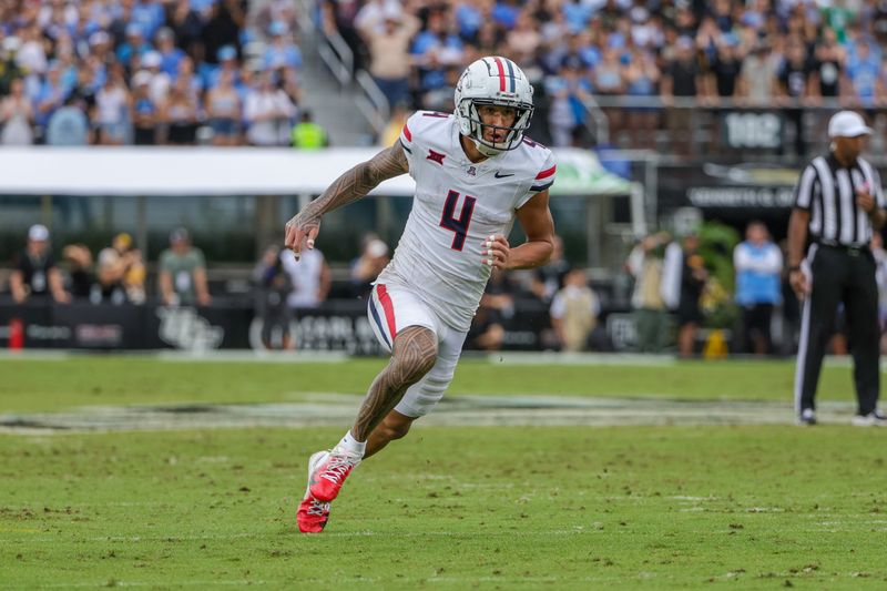 Nov 2, 2024; Orlando, Florida, USA; Arizona Wildcats wide receiver Tetairoa McMillan (4) during the second quarter against the UCF Knights at FBC Mortgage Stadium. Mandatory Credit: Mike Watters-Imagn Images