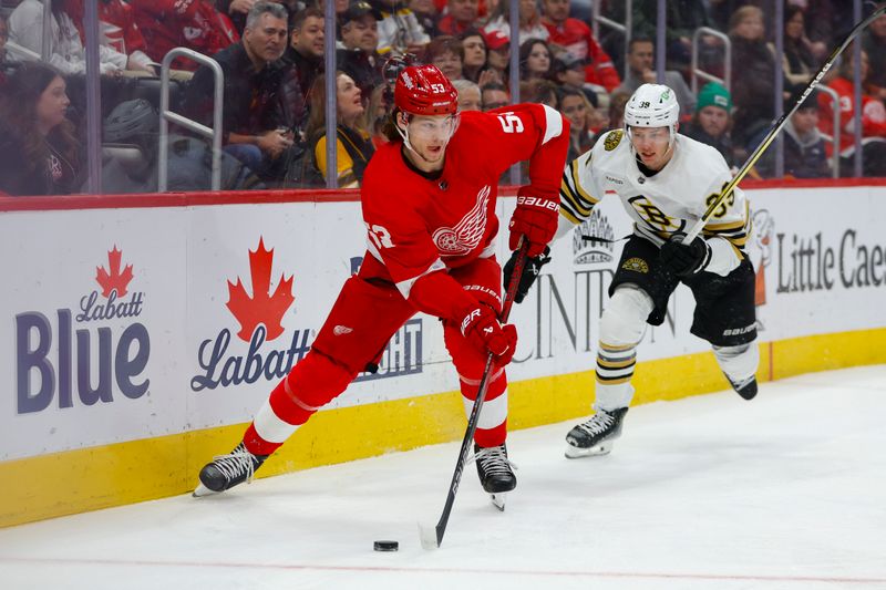 Dec 31, 2023; Detroit, Michigan, USA; Detroit Red Wings defenseman Moritz Seider (53) handles the puck during the first period of the game between the Boston Bruins and the Detroit Red Wings at Little Caesars Arena. Mandatory Credit: Brian Bradshaw Sevald-USA TODAY Sports