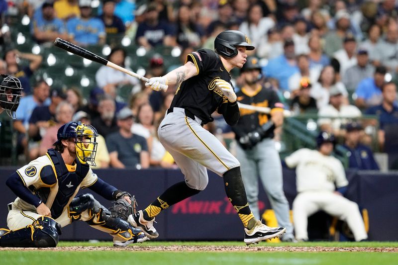 Jul 9, 2024; Milwaukee, Wisconsin, USA;  Pittsburgh Pirates center fielder Jack Suwinski (65) drives in a run during the sixth inning against the Milwaukee Brewers at American Family Field. Mandatory Credit: Jeff Hanisch-USA TODAY Sports