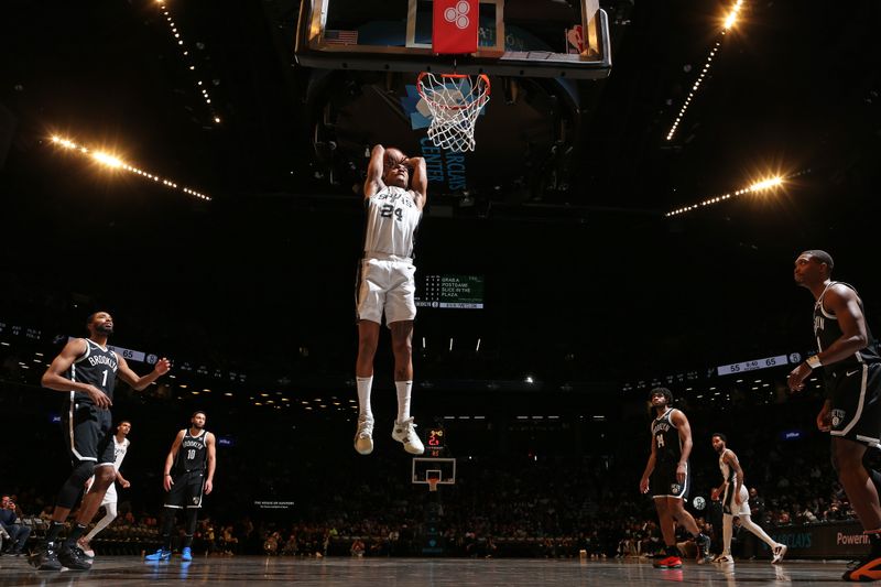 BROOKLYN, NY - FEBRUARY 10: Devin Vassell #24 of the San Antonio Spurs dunks the ball during the game against the Brooklyn Nets on February 10, 2024 at Barclays Center in Brooklyn, New York. NOTE TO USER: User expressly acknowledges and agrees that, by downloading and or using this Photograph, user is consenting to the terms and conditions of the Getty Images License Agreement. Mandatory Copyright Notice: Copyright 2024 NBAE (Photo by Nathaniel S. Butler/NBAE via Getty Images)