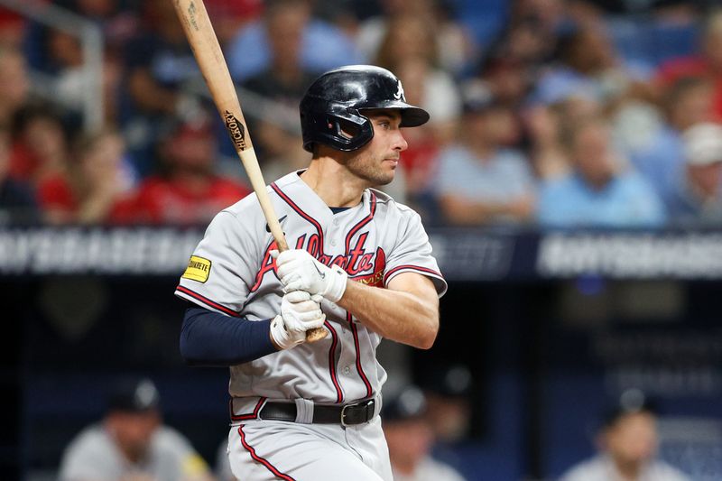 Jul 8, 2023; St. Petersburg, Florida, USA;  Atlanta Braves first baseman Matt Olson (28) hits an rbi single against the Tampa Bay Rays in the fourth inning at Tropicana Field. Mandatory Credit: Nathan Ray Seebeck-USA TODAY Sports